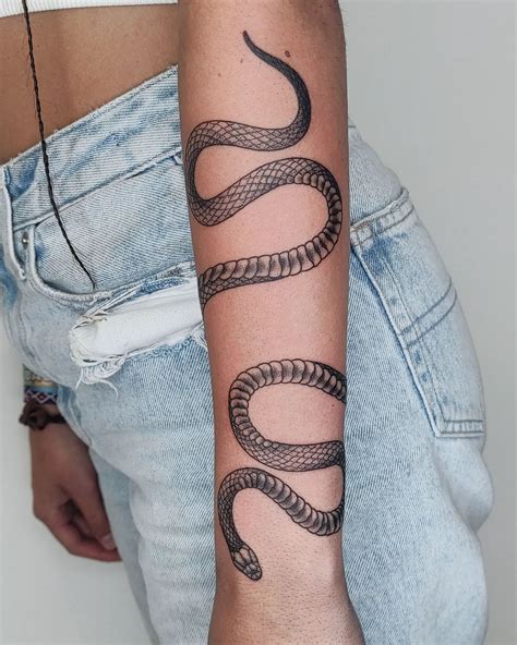 snake wrapped around leg tattoo meaning|Symbolism Of Snake Tattoos: Meaning, Types, And。